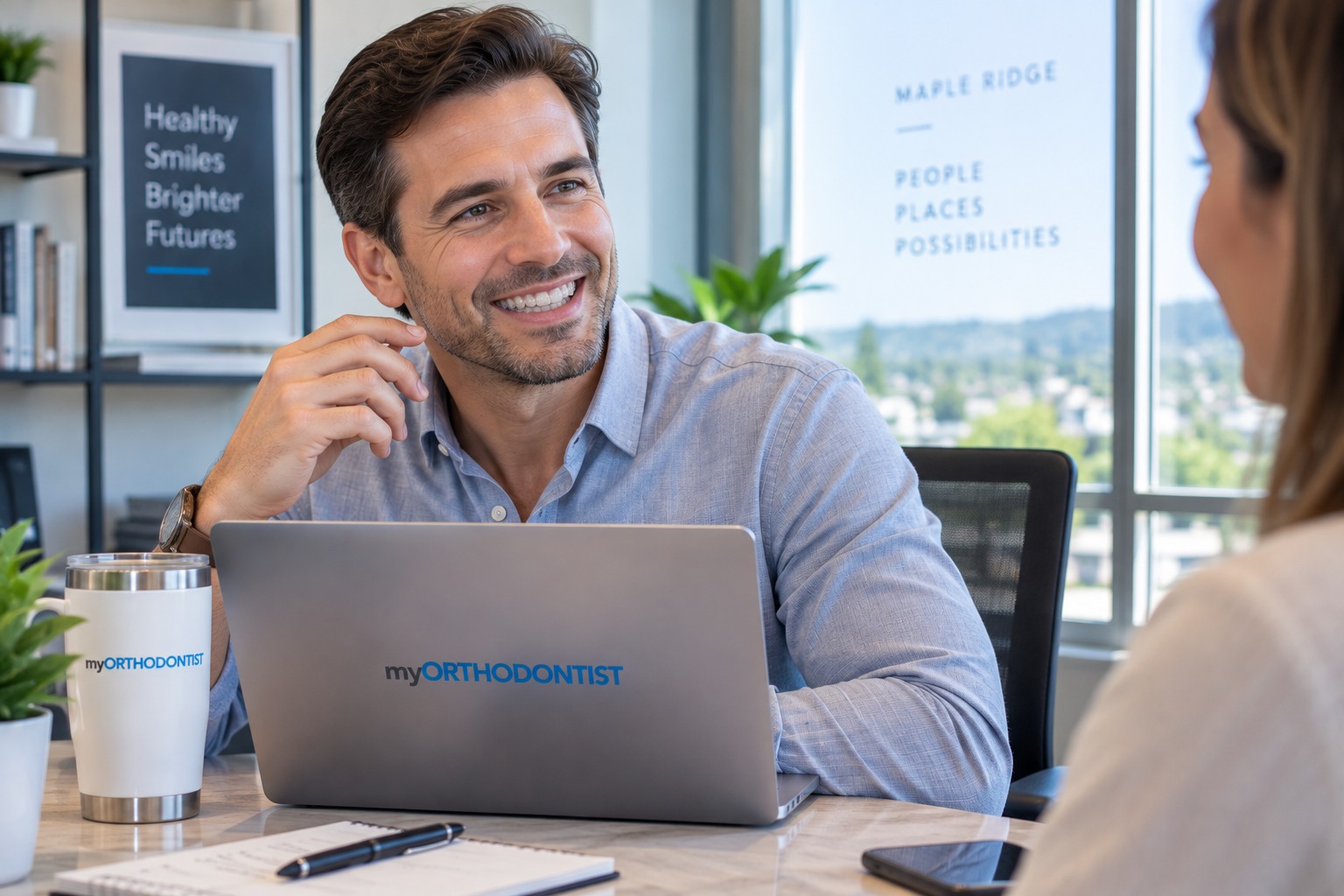Adult professional wearing clear Invisalign aligners during a normal workday in Maple Ridge