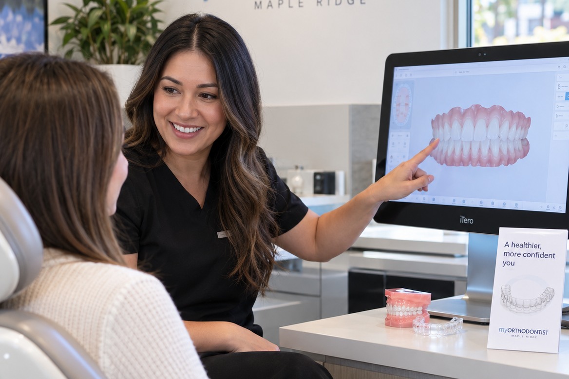Treatment coordinator reviewing an iTero digital scan with a patient at myORTHODONTIST Maple Ridge